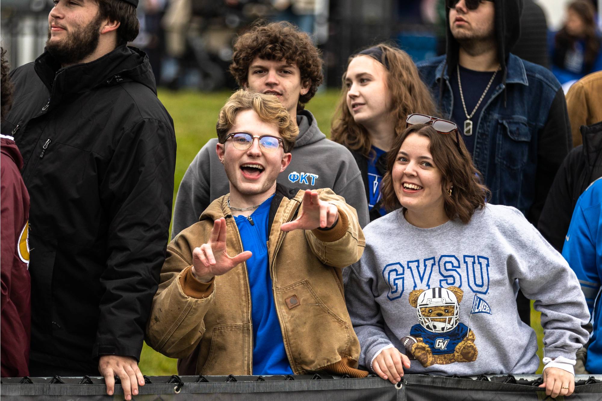 student looks excited at football game